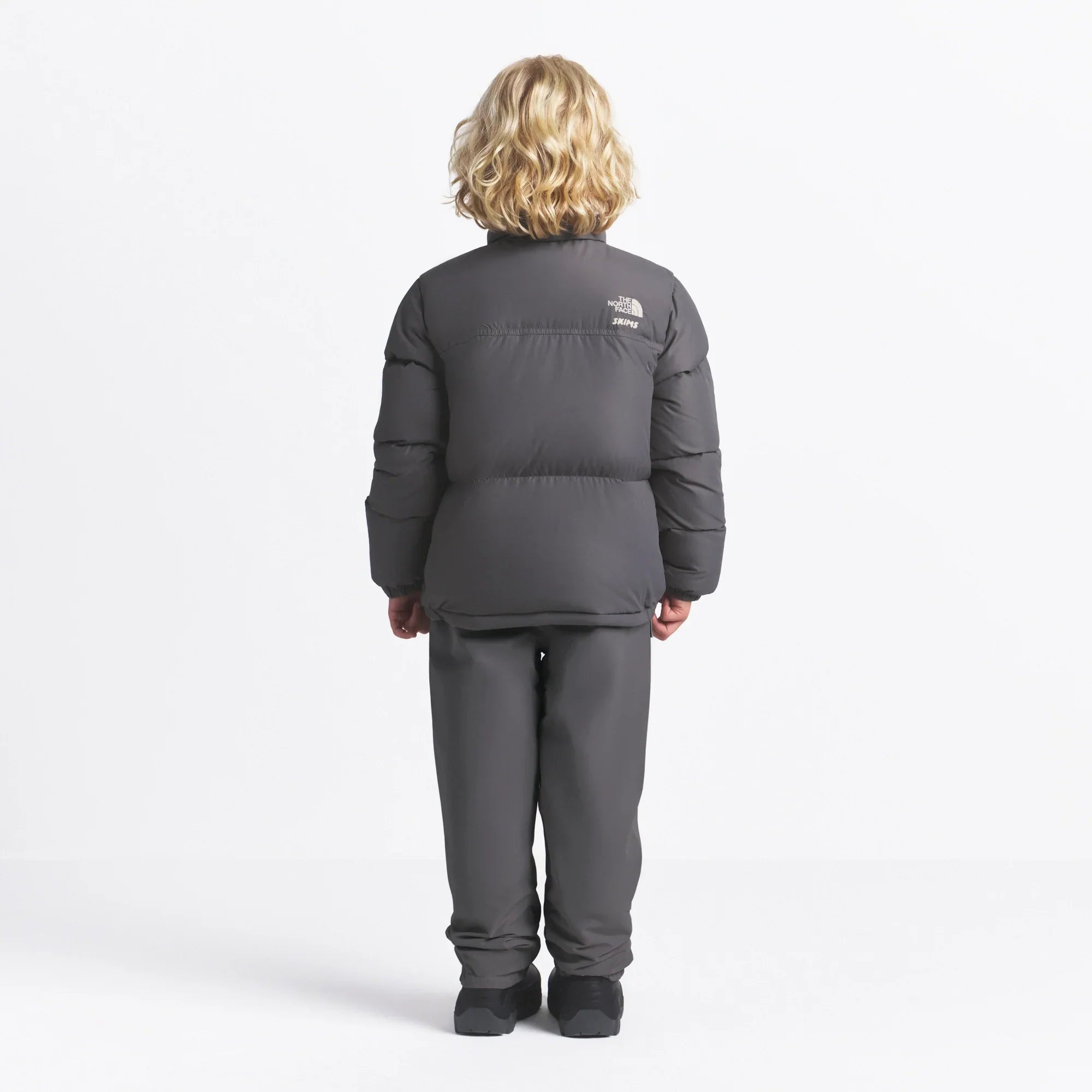THE NORTH FACE X SKIMS KIDS’ 1996 NUPTSE JACKET | GUNMETAL - Sneaker Türkiye